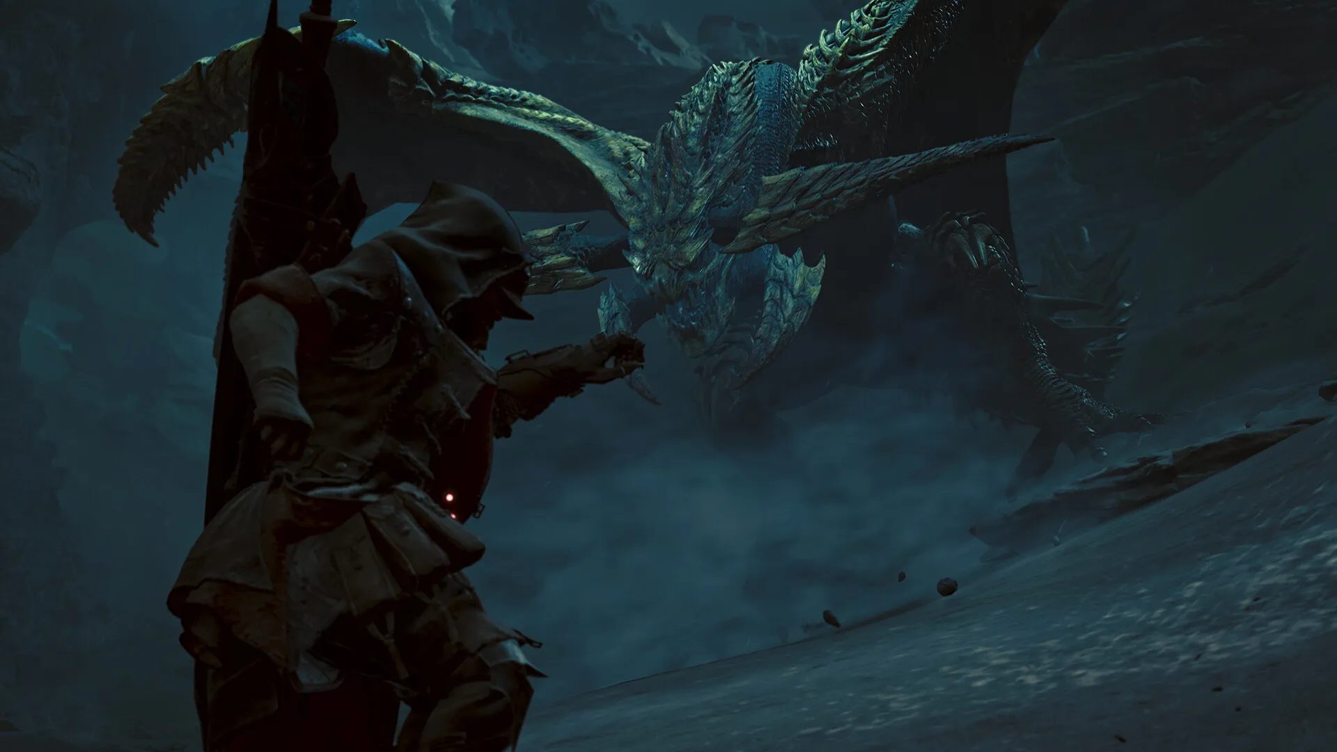 Monster Hunter Wilds : un chasseur capuche face à un wyverne ailee dans une grotte rocheuse aux reflets bleutes : visuel officiel